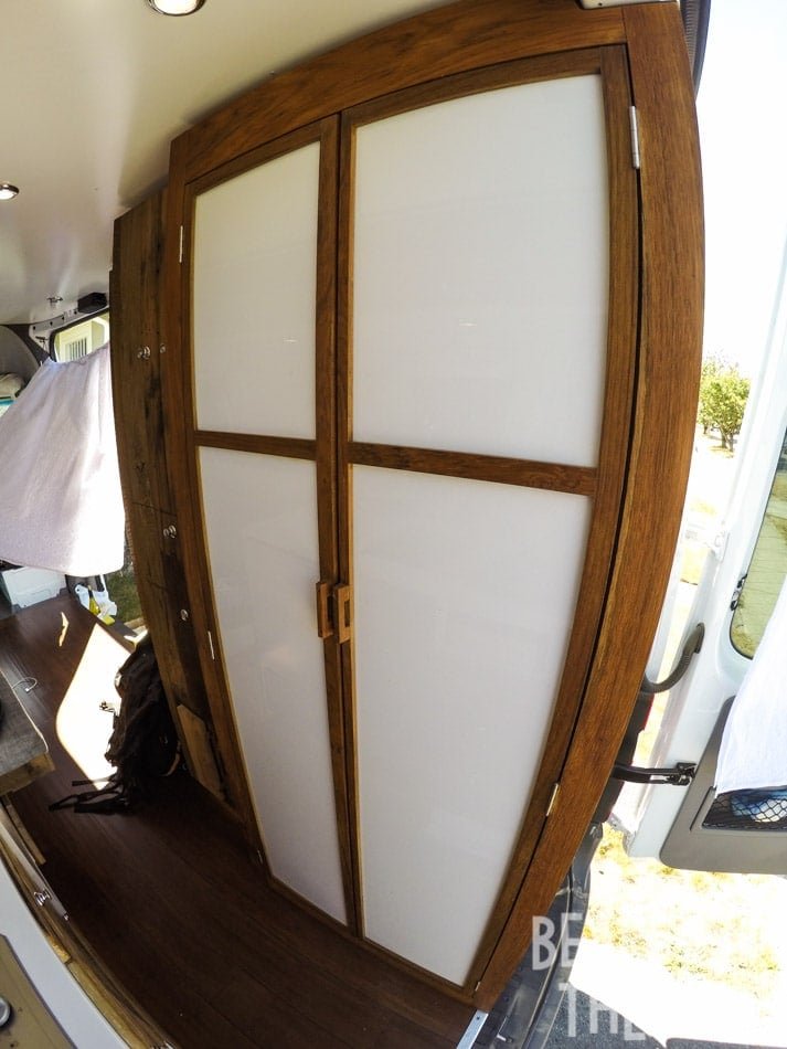 Floor to cieling custom bathroom with a shower and porta-potti in Alaina's first Mercedes sprinter camper van