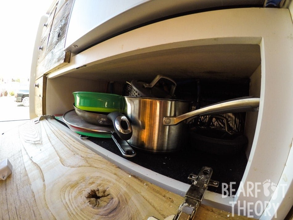 Pull down cabinet storage space in the galley of Alaina's 4x4 merecdes sprinter van
