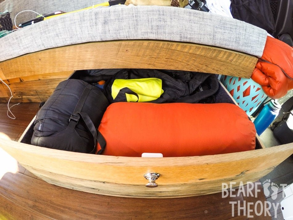 Pull out drawer for gear storage under the sofa bed in Alaina's first 4x4 Mercedes Sprinter Van