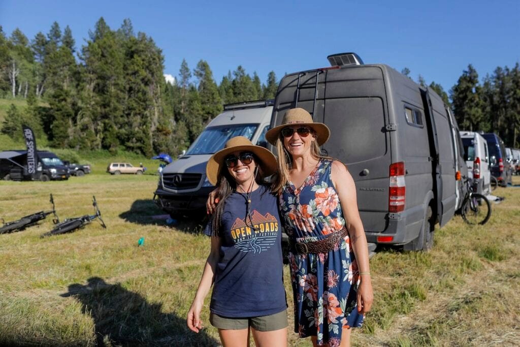 Alaina Hermiston and woman standing next to vans at Open Roads Fest
