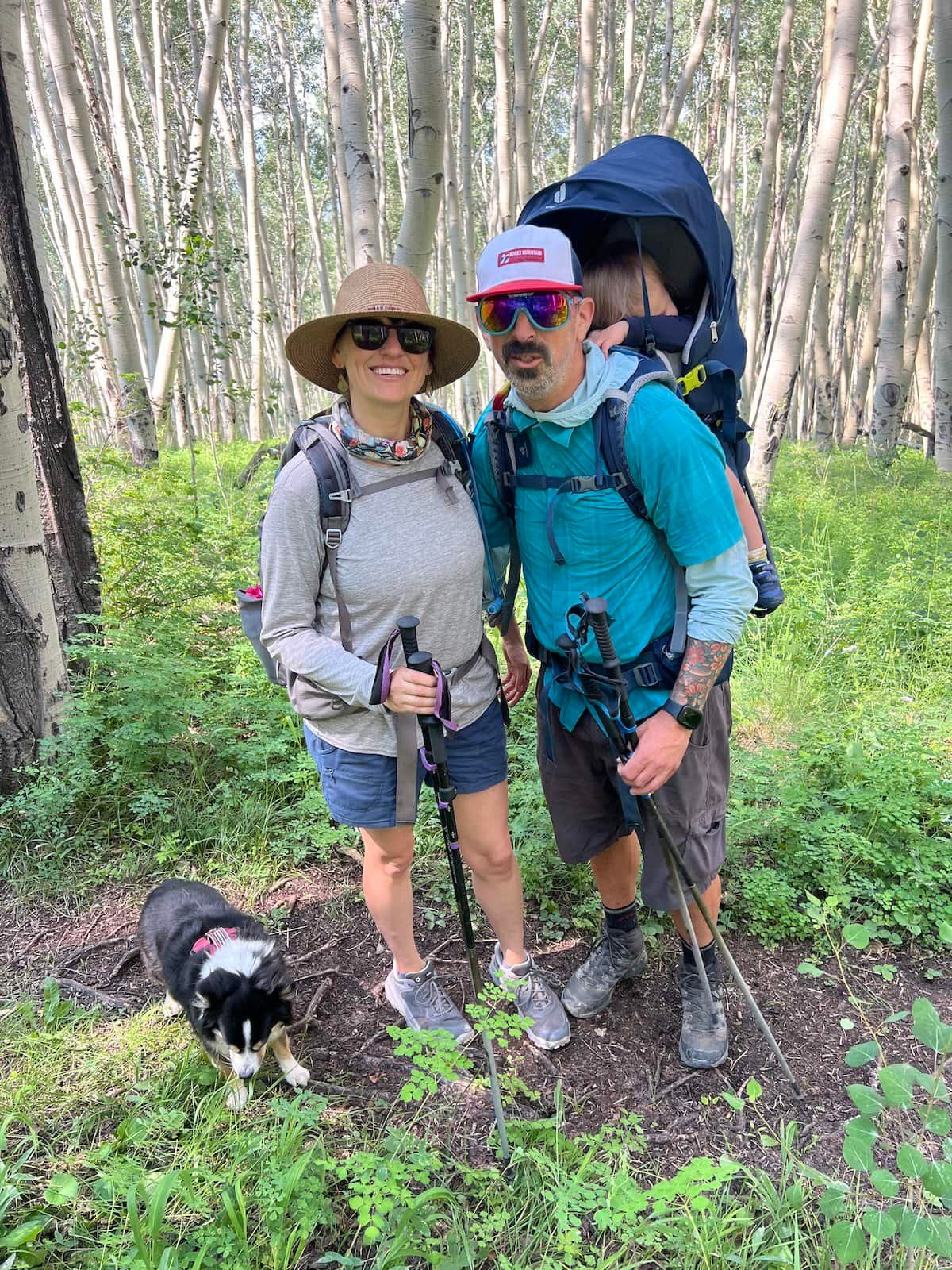 Couple hiking with baby in a backpack