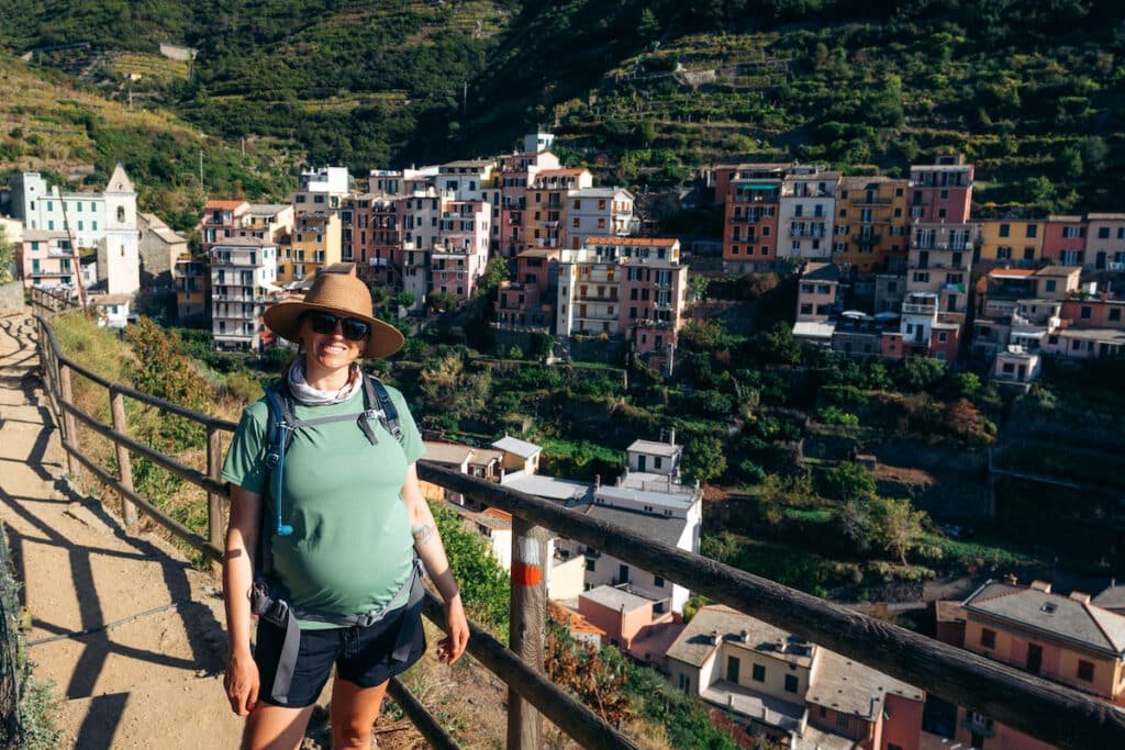 Alaina Hermiston hiking on Italy's Cinque Terre Trail wearing the Patagonia Cool Capilene daily hiking shirt