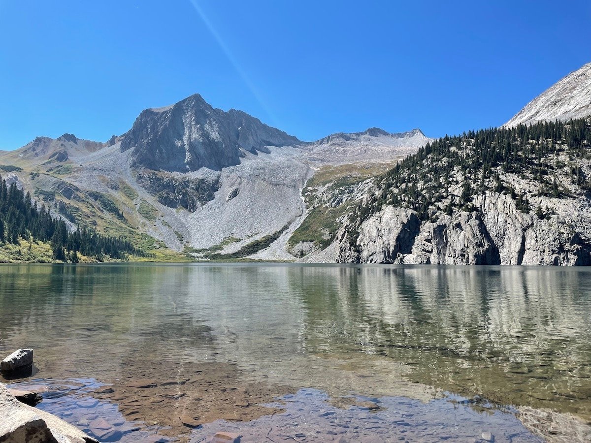 Snowmass Lake on the Four Pass Loop with mountains in the background.
