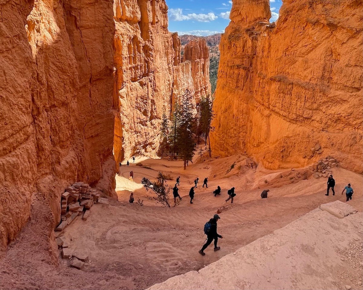People walking on switchbacks along the Navajo Loop Trail in Bryce Canyon National Park.