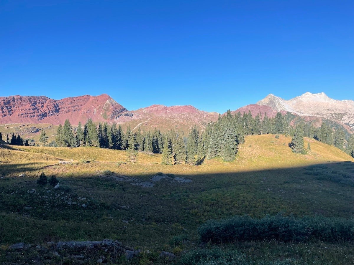 The Maroon Bells in the morning light from the ascent of Buckskin Pass