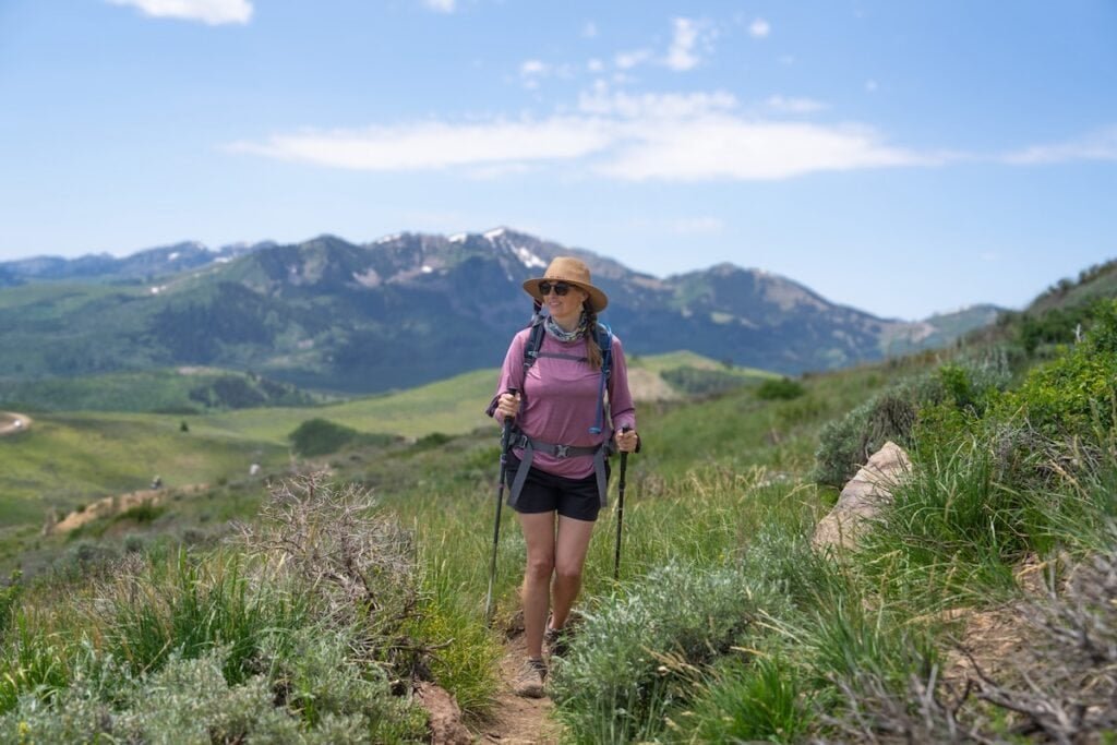 Alaina Hermiston hiking with Black Diamond FLZ trekking poles at Deer Valley on a summer day
